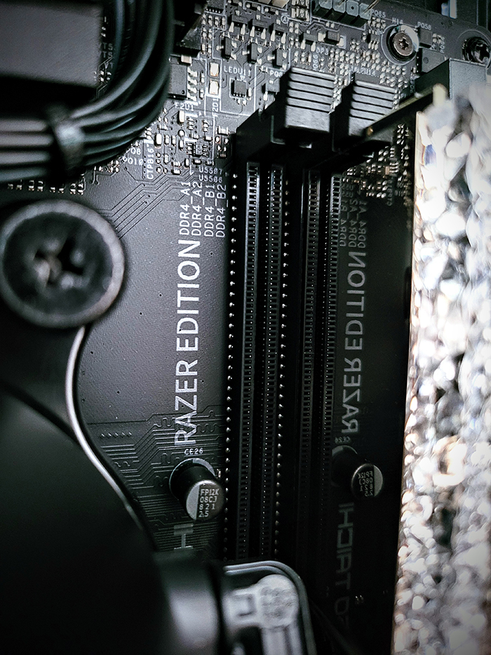Close-up of black motherboard with crystal RAM